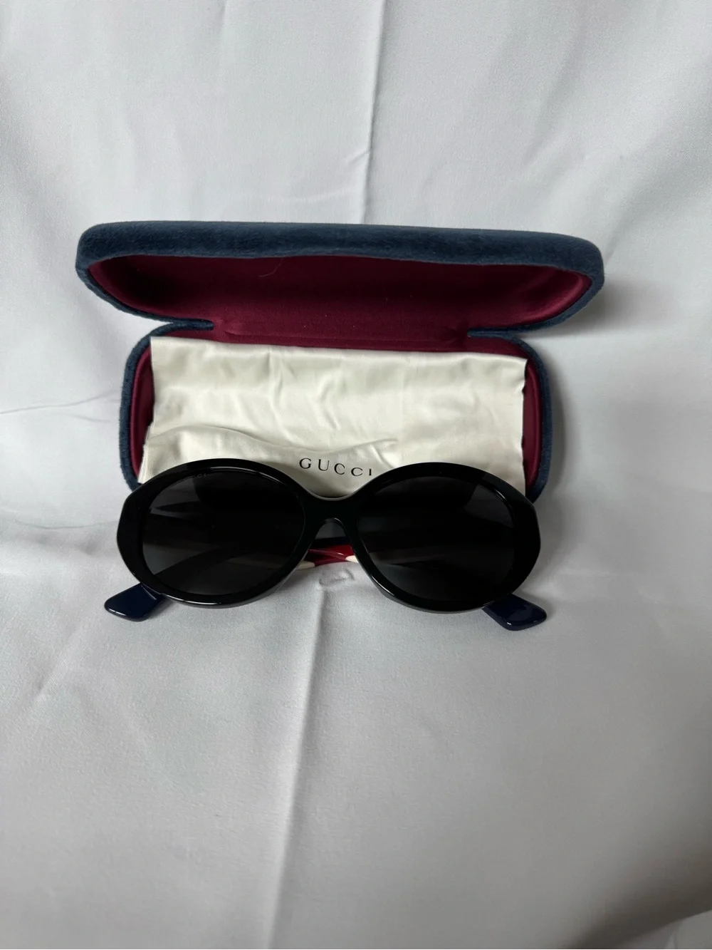 Gucci Black Oval Women's Sunglasses with Navy Temples